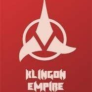 A striking red background features the white emblem of the Klingon Empire. Below the emblem, the words "KLINGON EMPIRE" are written in a stylized, futuristic font. The image is a promotional graphic for a podcast, and the Scots Klingon Podcast recently interviewed some of the OH!CAST team.